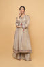 Beige Sharara Set adorned with elegant neck tassel details.